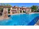 Sparkling community pool with a covered seating area and trellis, perfect for relaxation and socializing at 20100 N 78Th N Pl # 3212, Scottsdale, AZ 85255