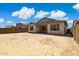 Expansive backyard with block fencing and covered patio ready for customization at 20606 E Avenida Del Valle Ct, Queen Creek, AZ 85142