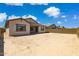 Vast backyard space with block fence and charming covered patio area, ready for landscaping at 20606 E Avenida Del Valle Ct, Queen Creek, AZ 85142