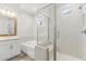 A well-lit bathroom with tile floor, a soaking tub, and glass enclosed shower at 20606 E Avenida Del Valle Ct, Queen Creek, AZ 85142