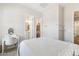 Serene bedroom with neutral tones, carpet, and access to a walk-in closet and bathroom at 20606 E Avenida Del Valle Ct, Queen Creek, AZ 85142