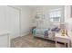 Bright bedroom featuring a cozy bed, soft carpet, and a charming decorative display at 20606 E Avenida Del Valle Ct, Queen Creek, AZ 85142