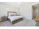 A bright bedroom features neutral paint and wood furniture at 20606 E Avenida Del Valle Ct, Queen Creek, AZ 85142