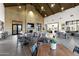 Open community amenity space featuring dining tables, comfortable seating, and modern decor at 20606 E Avenida Del Valle Ct, Queen Creek, AZ 85142