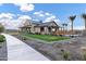 Community clubhouse boasts ample seating, stylish design, and lush landscaping at 20606 E Avenida Del Valle Ct, Queen Creek, AZ 85142