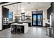 Modern community kitchen with sleek black cabinetry, quartz countertops, and stainless appliances at 20606 E Avenida Del Valle Ct, Queen Creek, AZ 85142