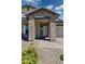 Welcoming front entrance with brick columns, pavers, and a covered porch at 20606 E Avenida Del Valle Ct, Queen Creek, AZ 85142