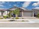 Charming single-Gathering home featuring a brick-accented facade and well-manicured landscaping at 20606 E Avenida Del Valle Ct, Queen Creek, AZ 85142