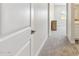 Bright hallway with neutral carpet leads to the bedroom; white trim and doors at 20606 E Avenida Del Valle Ct, Queen Creek, AZ 85142