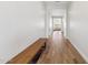 Bright hallway featuring wood-look tile flooring and a bench with storage space at 20606 E Avenida Del Valle Ct, Queen Creek, AZ 85142