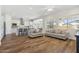 Open living room flowing into kitchen with lots of light at 20606 E Avenida Del Valle Ct, Queen Creek, AZ 85142