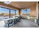 The spacious outdoor kitchen offers seating, a grill, and beautiful views at 20606 E Avenida Del Valle Ct, Queen Creek, AZ 85142