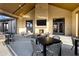 Cozy outdoor seating with a fireplace and mounted television for relaxing entertainment at 20606 E Avenida Del Valle Ct, Queen Creek, AZ 85142