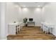 Large room with desks, chairs, and wood floors at 20606 E Avenida Del Valle Ct, Queen Creek, AZ 85142