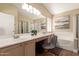Bright bathroom with double sinks, soaking tub, and tiled shower stall at 2247 E Ross Ave, Phoenix, AZ 85024