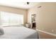 Bedroom with neutral walls, carpeted floor, and en-suite bathroom at 2247 E Ross Ave, Phoenix, AZ 85024