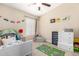 bedroom with a car themed carpet, playful decor, and neutral walls at 2247 E Ross Ave, Phoenix, AZ 85024