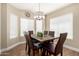 Dining room with a chandelier, natural lighting, and comfortable seating at 2247 E Ross Ave, Phoenix, AZ 85024