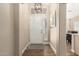 Inviting entryway featuring a pendant light, wood-look floors, and neutral paint at 2247 E Ross Ave, Phoenix, AZ 85024