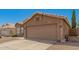 This home features a spacious two-car garage, desert landscaping, and a neutral color scheme at 2247 E Ross Ave, Phoenix, AZ 85024