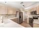 Bright kitchen with stainless steel appliances and ample countertop space at 2247 E Ross Ave, Phoenix, AZ 85024