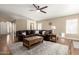 Living room with a ceiling fan, ample seating, and modern decor at 2247 E Ross Ave, Phoenix, AZ 85024