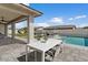 Backyard view featuring a sparkling pool, a covered patio and an outdoor dining area at 22991 E Via De Olivos --, Queen Creek, AZ 85142