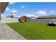 Backyard featuring a play structure and artificial turf at 22991 E Via De Olivos --, Queen Creek, AZ 85142