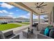 Inviting backyard features a covered patio, in-ground pool and grassy area perfect for relaxation at 22991 E Via De Olivos --, Queen Creek, AZ 85142