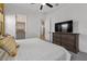 Tastefully decorated bedroom with white bedding, dresser, and walk-in closet at 22991 E Via De Olivos --, Queen Creek, AZ 85142