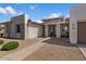 Beautiful new construction home featuring desert landscaping and a modern entryway at 22991 E Via De Olivos --, Queen Creek, AZ 85142
