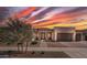 Beautiful single-Gathering home with desert landscaping and a stunning sunset sky at 22991 E Via De Olivos --, Queen Creek, AZ 85142