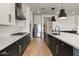 Modern kitchen featuring a center island, stainless steel appliances and sleek countertops, creating a workspace at 22991 E Via De Olivos --, Queen Creek, AZ 85142