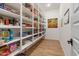 Spacious walk-in pantry with floor-to-ceiling shelving and ample storage space for food and household items at 22991 E Via De Olivos --, Queen Creek, AZ 85142