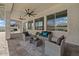 This comfortable outdoor seating area features three fans and sliding glass doors at 22991 E Via De Olivos --, Queen Creek, AZ 85142