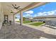 Extensive covered patio offers inviting lounge areas and a beautiful green lawn for entertainment at 22991 E Via De Olivos --, Queen Creek, AZ 85142