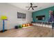 Bright playroom with colorful accents, ample storage, and a mounted television at 22991 E Via De Olivos --, Queen Creek, AZ 85142