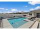Backyard pool with seating, patio, BBQ and views of neighboring roofs at 22991 E Via De Olivos --, Queen Creek, AZ 85142