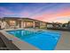 Backyard pool view with outdoor dining area and lounge chairs perfect for sunset evenings at 22991 E Via De Olivos --, Queen Creek, AZ 85142