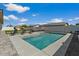Sparkling pool with clear water, concrete trim, and surrounding green space at 22991 E Via De Olivos --, Queen Creek, AZ 85142