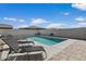 Sparkling pool with lounge chairs and a block wall provide a private backyard oasis at 22991 E Via De Olivos --, Queen Creek, AZ 85142