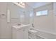 Bright bathroom featuring a vanity, mirror, and a combined shower and bathtub at 2617 N 40Th Ave, Phoenix, AZ 85009