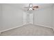 An airy bedroom with a ceiling fan and neutral walls, showcasing closet access at 2617 N 40Th Ave, Phoenix, AZ 85009