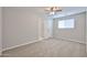This bedroom features carpeted floors, a ceiling fan and a closet for ample storage space at 2617 N 40Th Ave, Phoenix, AZ 85009