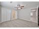 This bedroom features carpeted floors, a ceiling fan and a closet for ample storage space at 2617 N 40Th Ave, Phoenix, AZ 85009