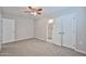 This bedroom features carpeted floors, a ceiling fan and a closet for ample storage space at 2617 N 40Th Ave, Phoenix, AZ 85009