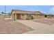 A house featuring a carport and front yard with drought-tolerant landscaping at 2617 N 40Th Ave, Phoenix, AZ 85009