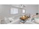 Bright living room features neutral colors, comfortable seating, and a ceiling fan at 2617 N 40Th Ave, Phoenix, AZ 85009