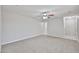 Carpeted living room with natural light and ceiling fan at 2617 N 40Th Ave, Phoenix, AZ 85009