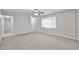 Spacious living room features carpet, neutral walls, and ceiling fan at 2617 N 40Th Ave, Phoenix, AZ 85009